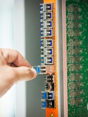 Engineer fixing core swith in data center room