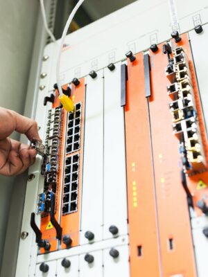 Engineer fixing core swith in data center room