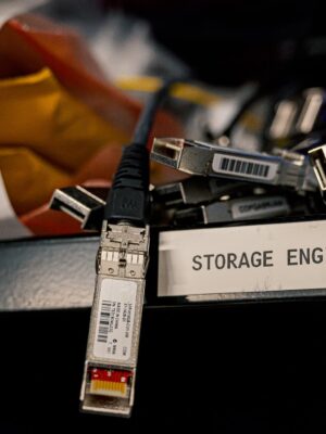 Low angle of various connectors and USB cables placed on shelf with storage engineer inscription